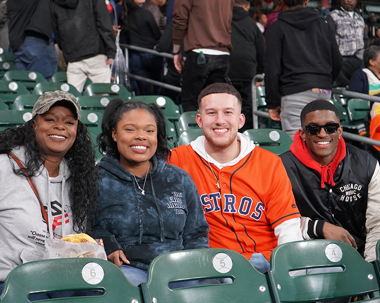 Photo of young adults at a Houston Astros game