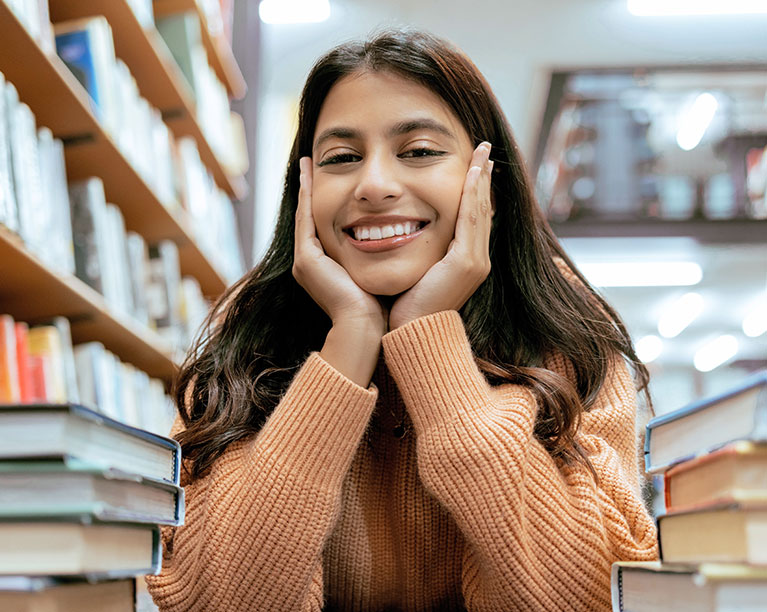 Photo of a female student in a library