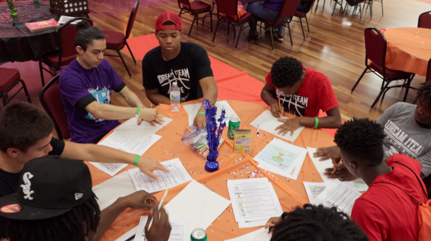 Photo of a group of young adults working together